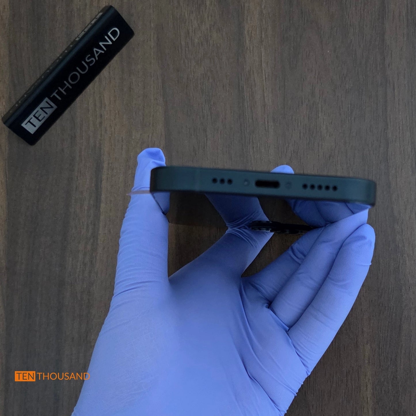 Bottom view of iPhone 13 hidden camera phone showing no additional openings or modifications