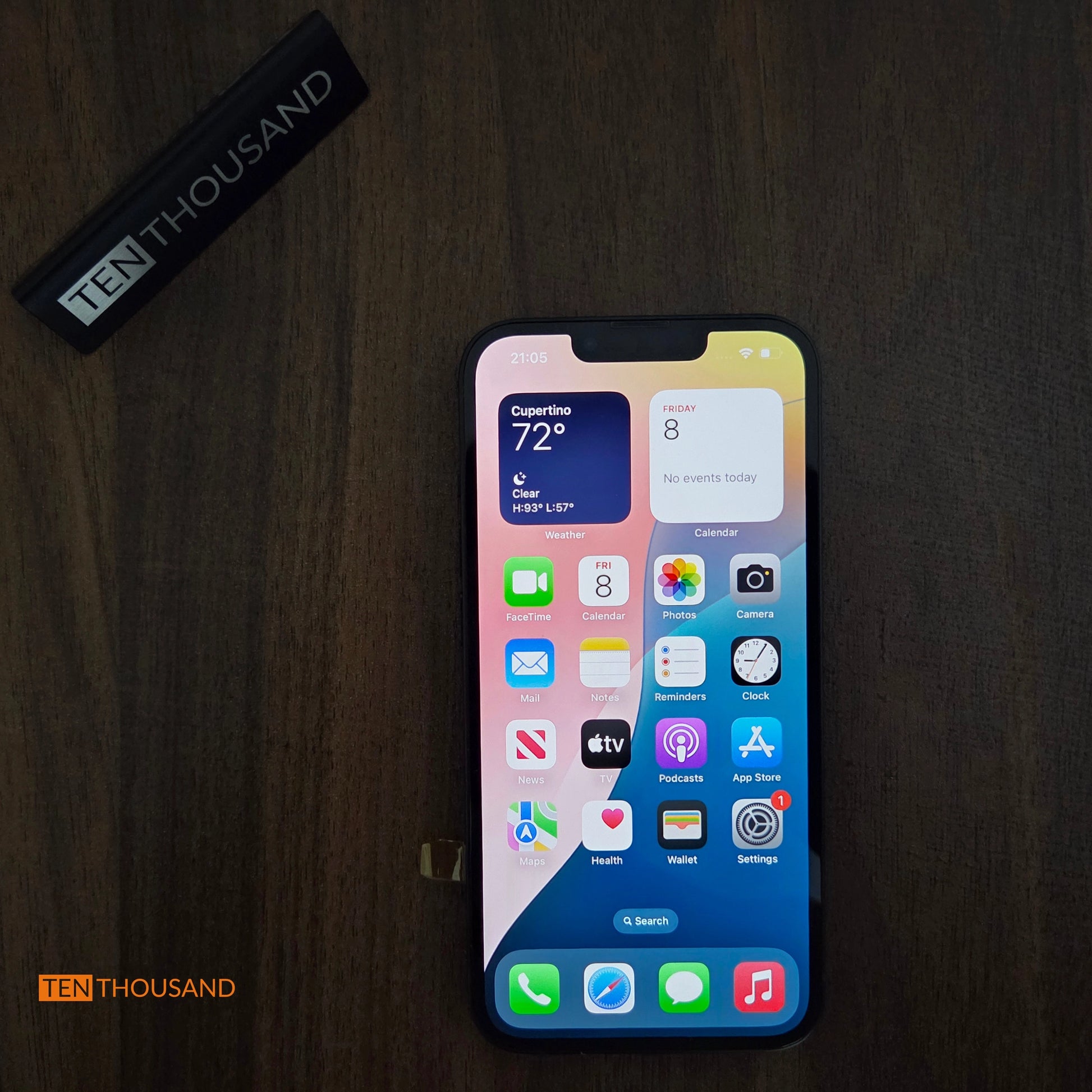 iPhone 13 hidden camera phone with screen turned on showing normal iOS interface