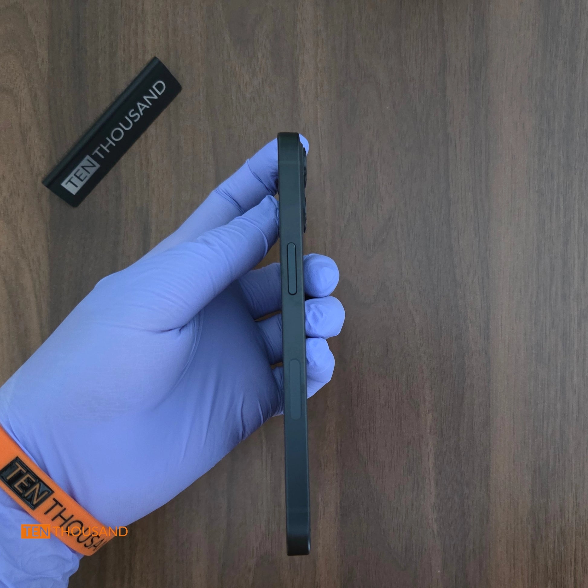 Side profile of iPhone 13 hidden camera phone with front camera aligned to the SIM card slot