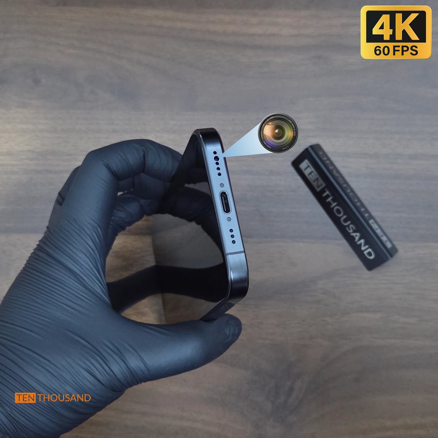 Close-up view of iPhone 16 Pro with front camera relocated to the bottom speaker hole for discreet recording