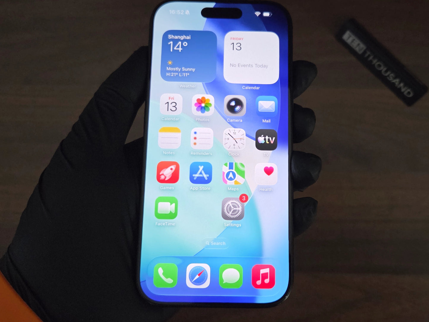 iPhone 16 Pro hidden camera phone with screen turned on showing normal iOS interface