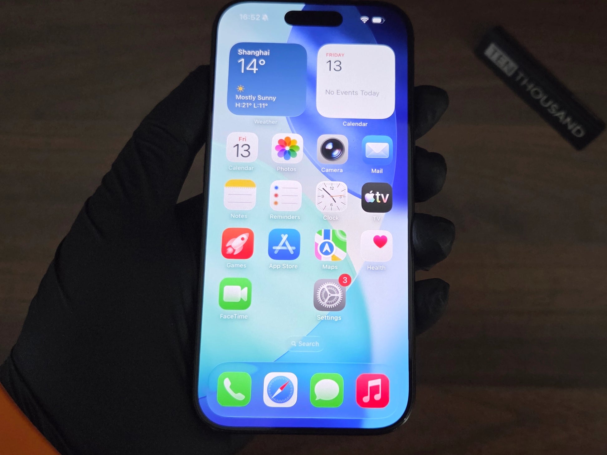 iPhone 16 Pro hidden camera phone with screen turned on showing normal iOS interface